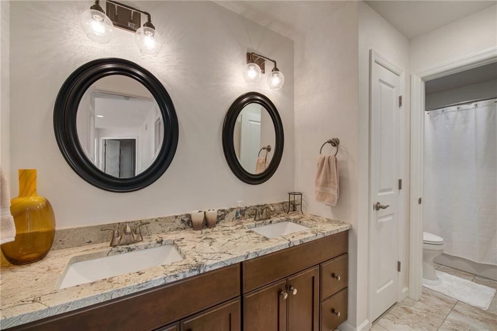 7372 Sierra Drive Irwin, PA 15642 - Photo 25 of 32 a bathroom with a granite countertop double vanity sink and a mirror