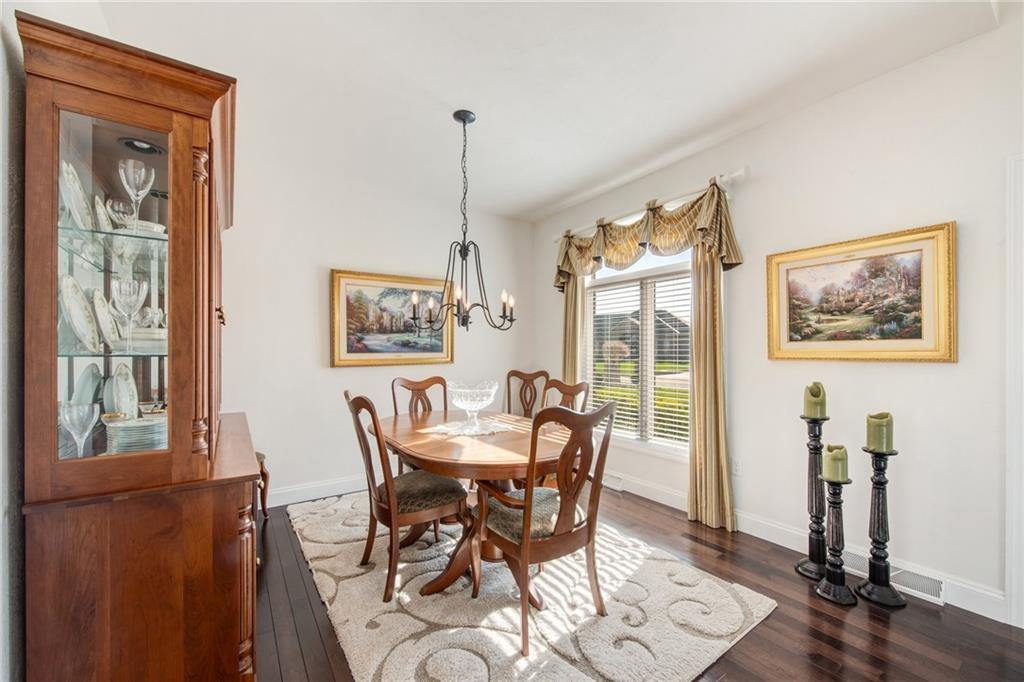 7372 Sierra Drive Irwin, PA 15642 - Photo 7 of 32 a view of a dining room with furniture window and wooden floor