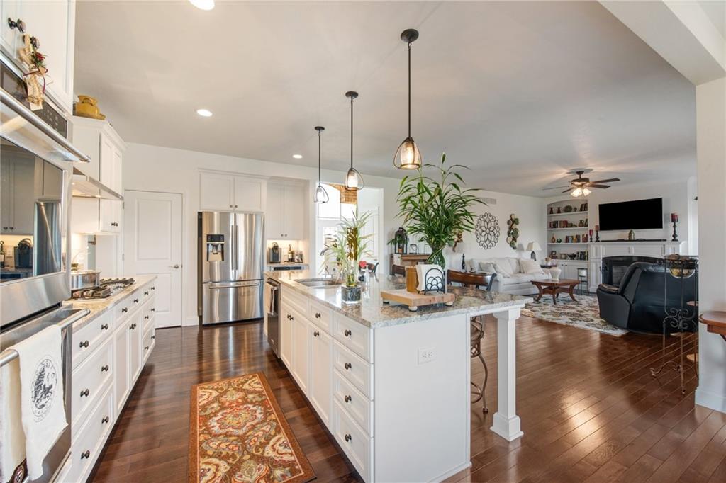 7372 Sierra Drive Irwin, PA 15642 - Photo 10 of 32 a kitchen with stainless steel appliances kitchen island granite countertop a stove a sink and a refrigerator