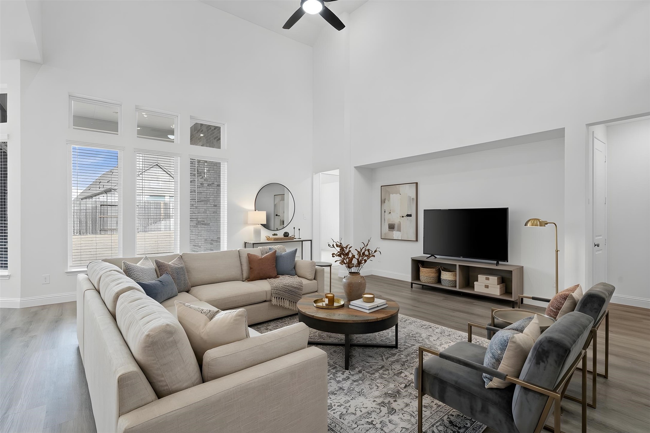 17315 July Moon Lane Conroe, TX 77302 - Photo 21 of 46 Enjoy the open and airy Family Room, designed for seamless entertaining and showcasing striking architectural details with high ceilings and durable flooring. *Virtually Staged