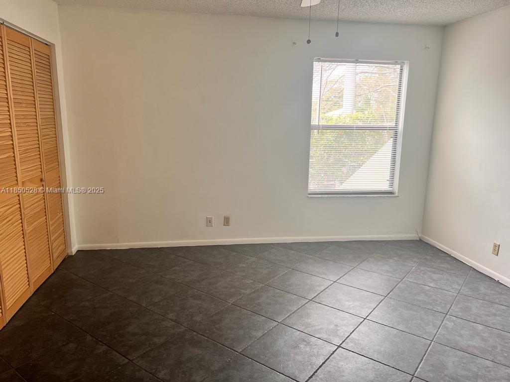 17 Crossings Circle, Unit E Boynton Beach, FL 33435 - Photo 15 of 20 an empty room with windows