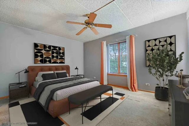 a bedroom with a bed and a potted plant