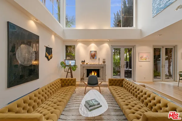 view of living room with furniture and a fireplace