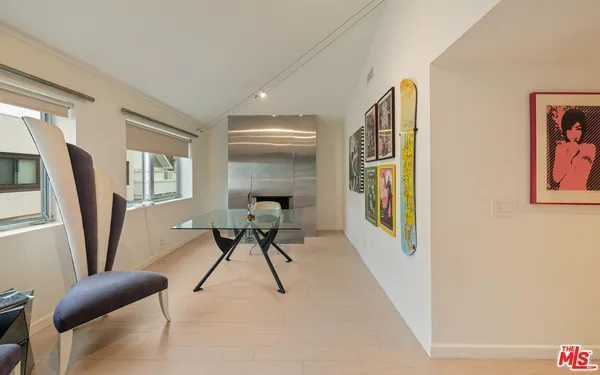 a work room with furniture and a window