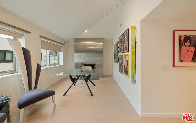 a work room with furniture and a window