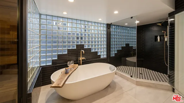 a balcony with table and chairs