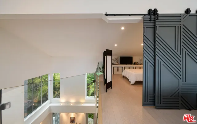 a bed room with a bed and a television