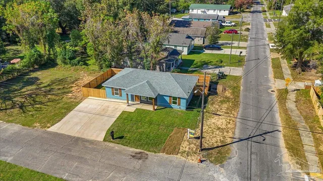 an aerial view of a house with a garden