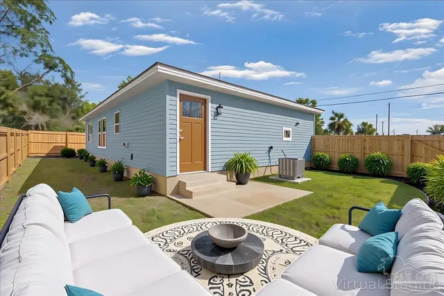 a view of a patio with couches chairs and a fire pit