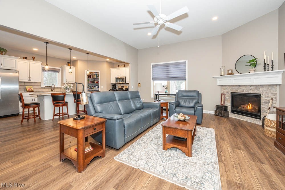 6580 Abbey Road North Canfield, OH 44406 - Photo 8 of 32 Living room featuring dark wood-style flooring, a fireplace, ceiling fan, and recessed lighting