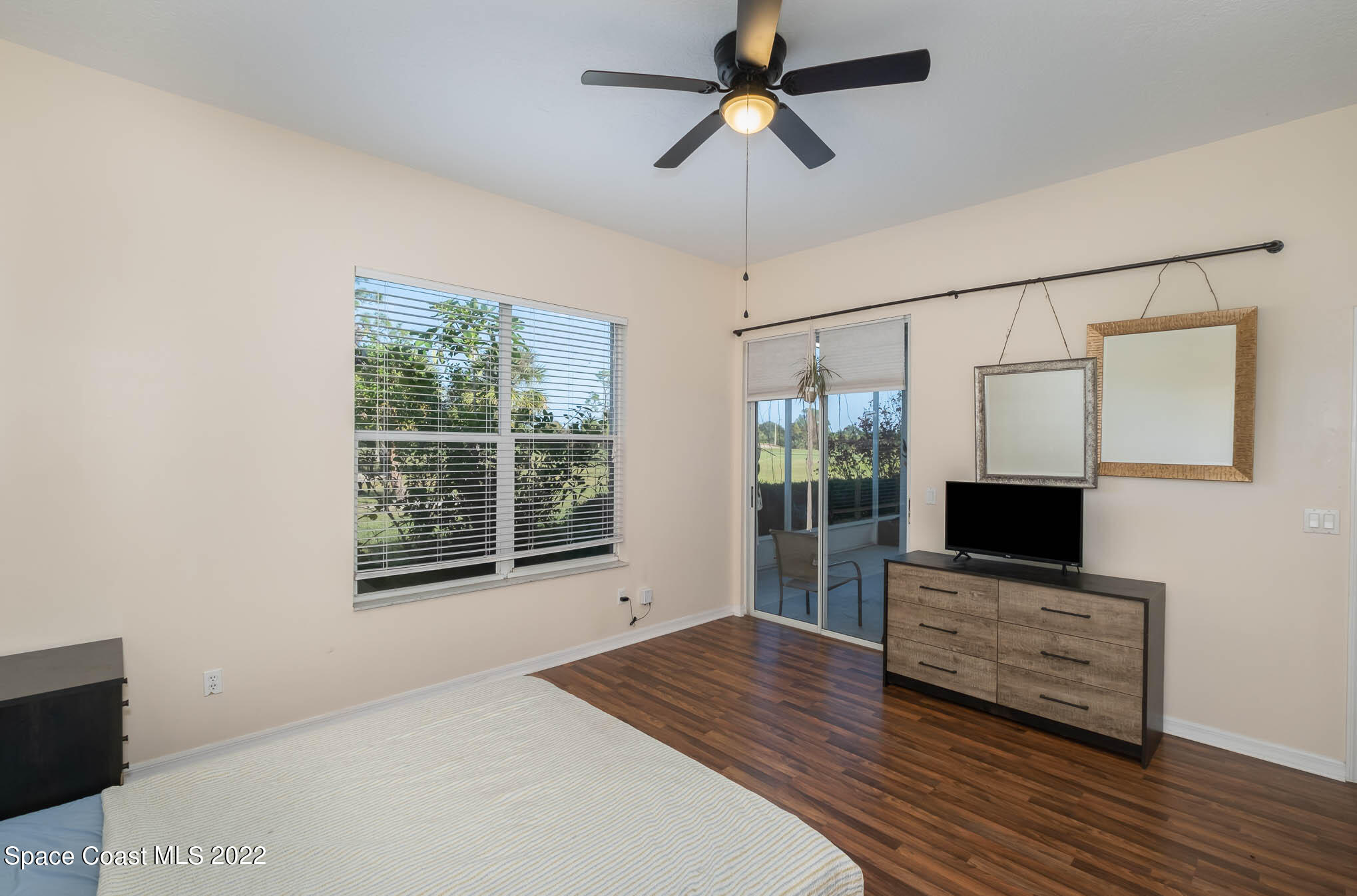 2364 Addington Circle Rockledge, FL 32955 - Photo 11 of 22 a bedroom with furniture and flat screen tv