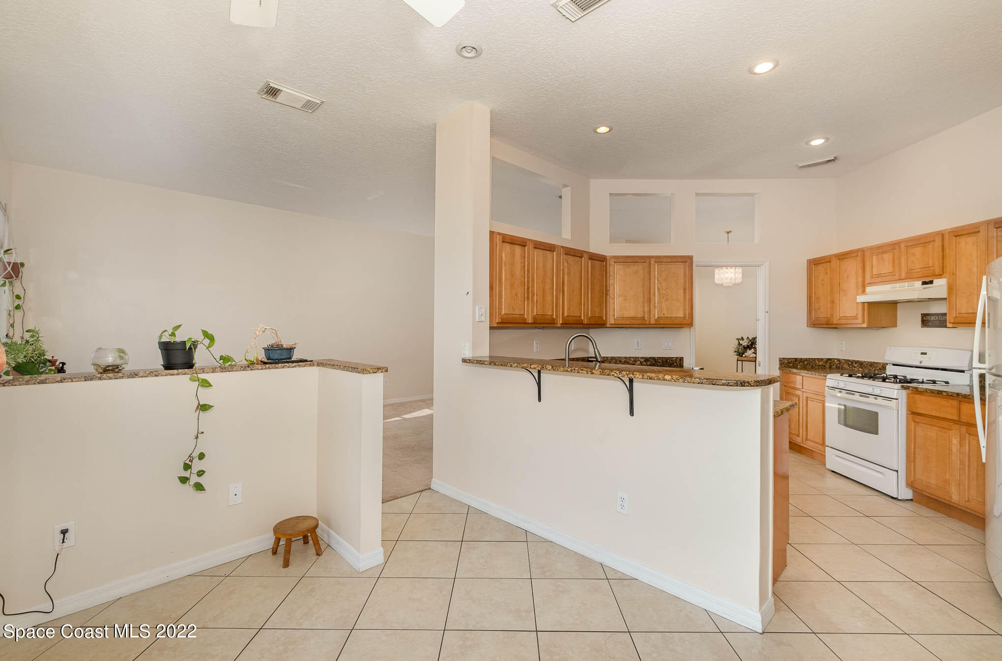 2364 Addington Circle Rockledge, FL 32955 - Photo 4 of 22 a kitchen with stainless steel appliances a refrigerator sink and microwave