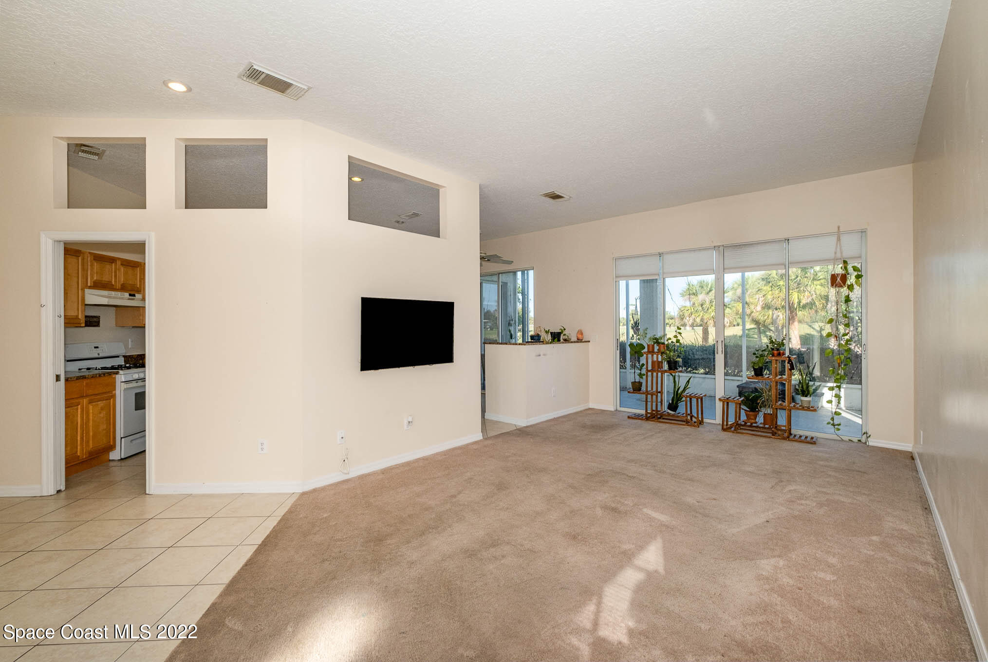 2364 Addington Circle Rockledge, FL 32955 - Photo 7 of 22 a view of a livingroom with an empty space and a window