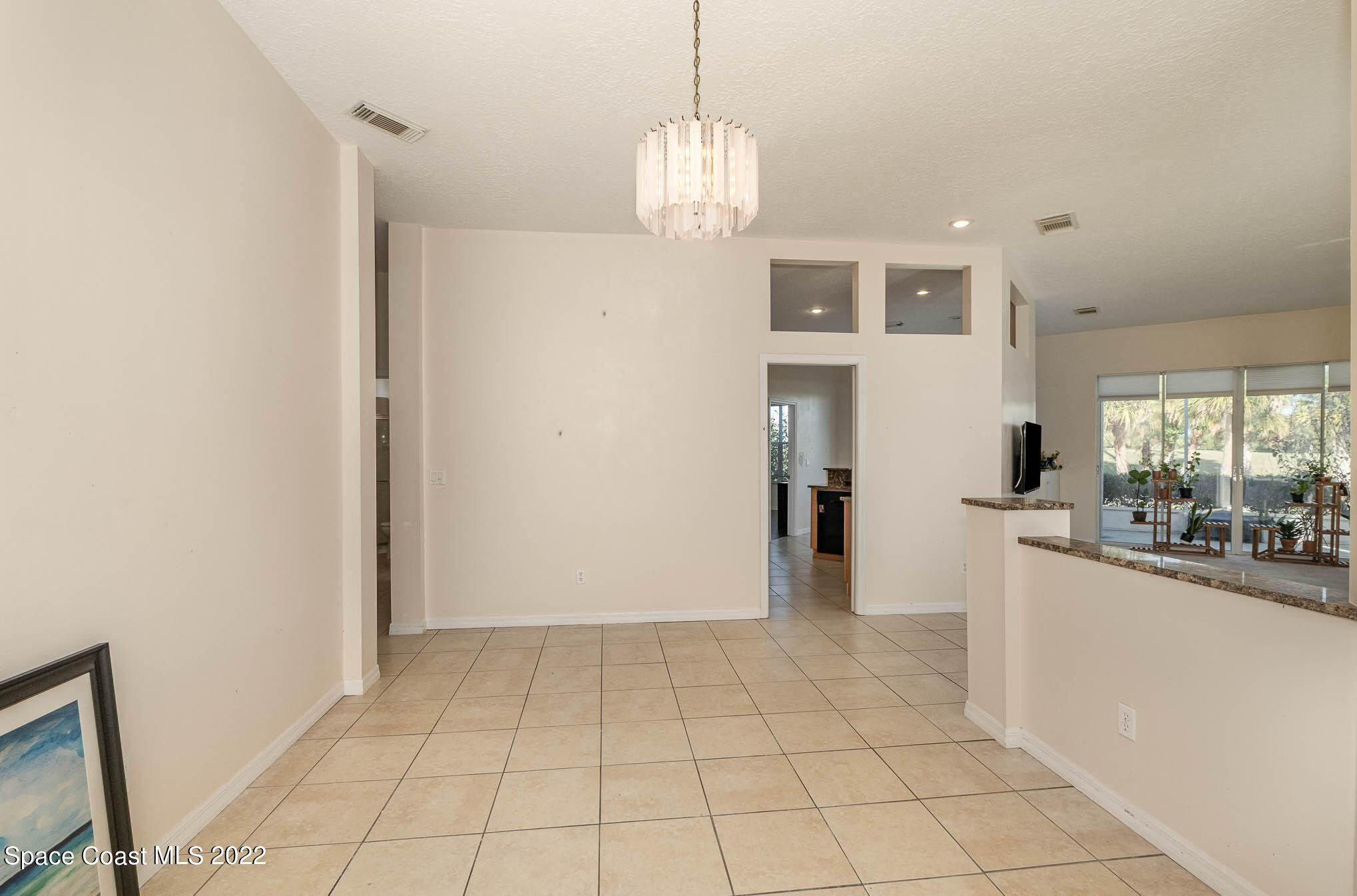 2364 Addington Circle Rockledge, FL 32955 - Photo 8 of 22 a view of a kitchen with microwave and cabinets