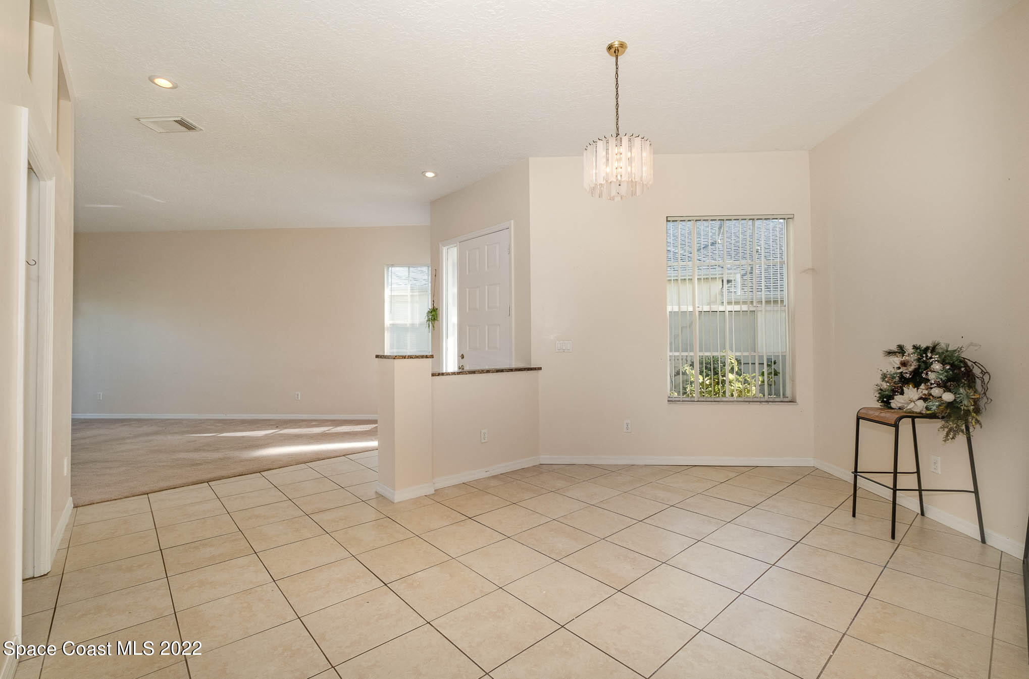 2364 Addington Circle Rockledge, FL 32955 - Photo 9 of 22 a view of an empty room with a window