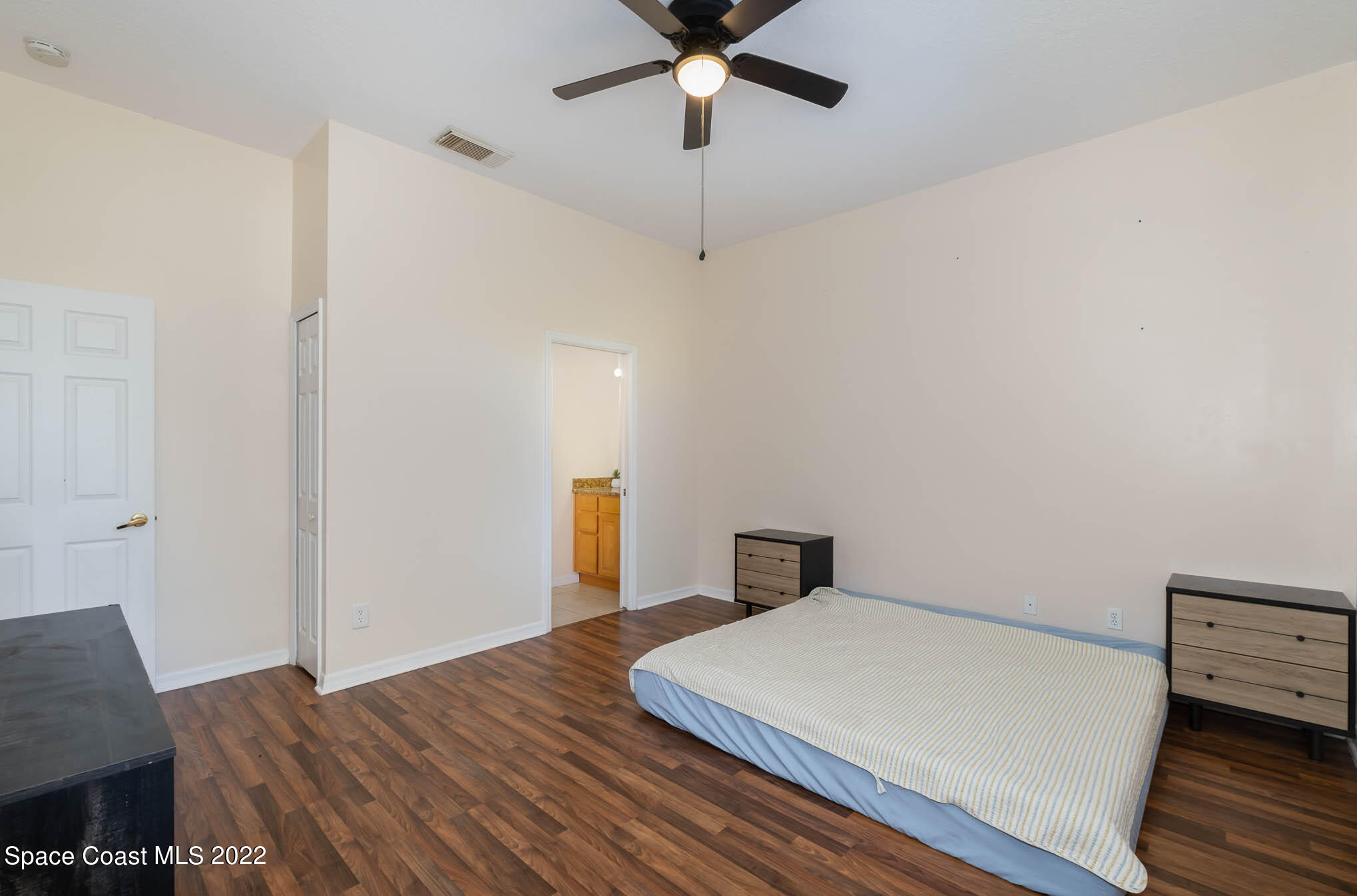 2364 Addington Circle Rockledge, FL 32955 - Photo 10 of 22 a bedroom with a bed and a table