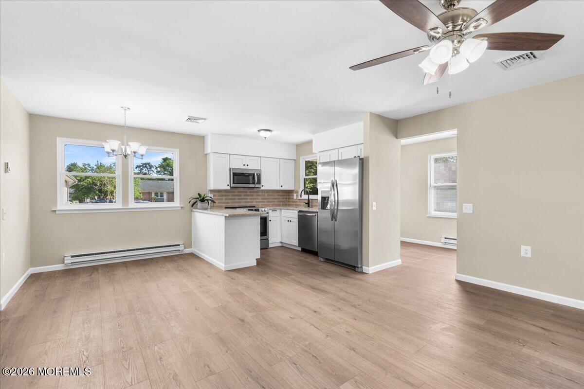 16 D Spring Street, Unit 50 Whiting, NJ 08759 - Photo 12 of 28 a view of a kitchen with a sink cabinets and wooden floor