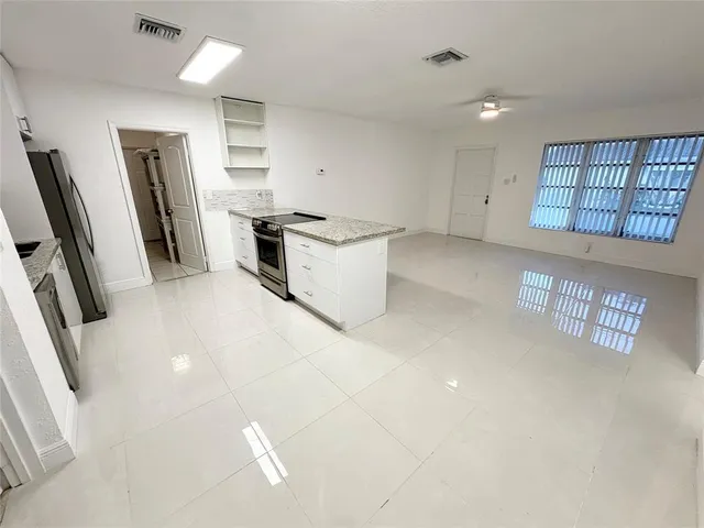 a bathroom with a toilet sink and vanity
