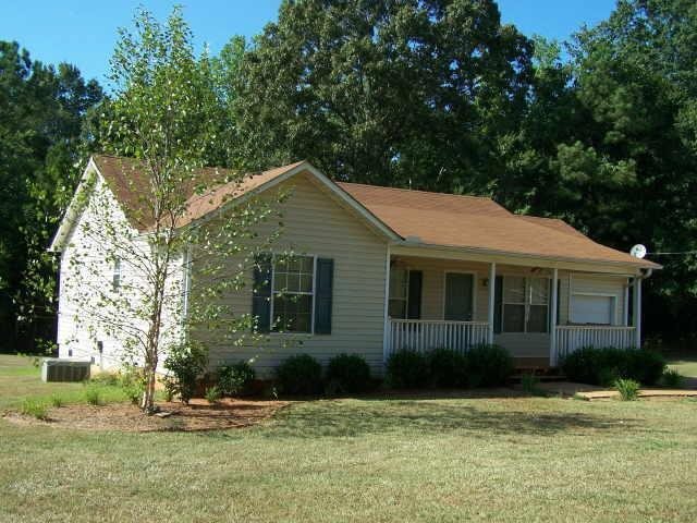 6024 Old Zebulon Road Concord, GA 30206 - Photo 1 of 1 a front view of a house with a yard