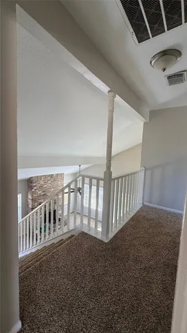a view of staircase and rug