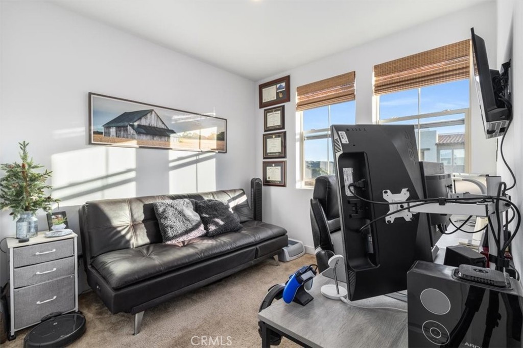 1201 Lasso Way Rancho Mission Viejo, CA 92694 - Photo 26 of 54 a living room with furniture a flat screen tv and a window