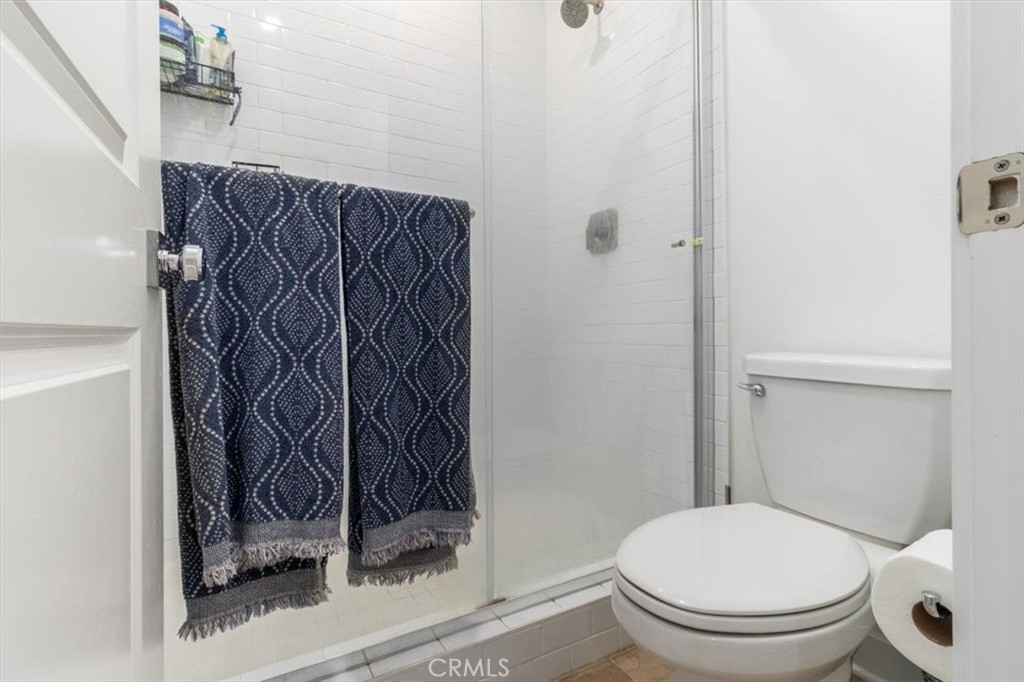 1201 Lasso Way Rancho Mission Viejo, CA 92694 - Photo 27 of 54 a bathroom with a toilet and a shower curtain