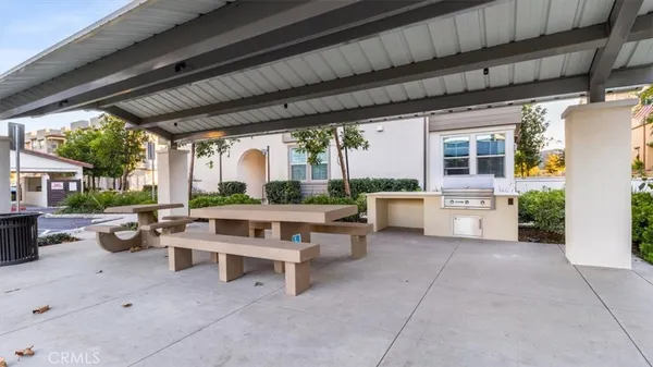 an outdoor space with lounge chair and a table