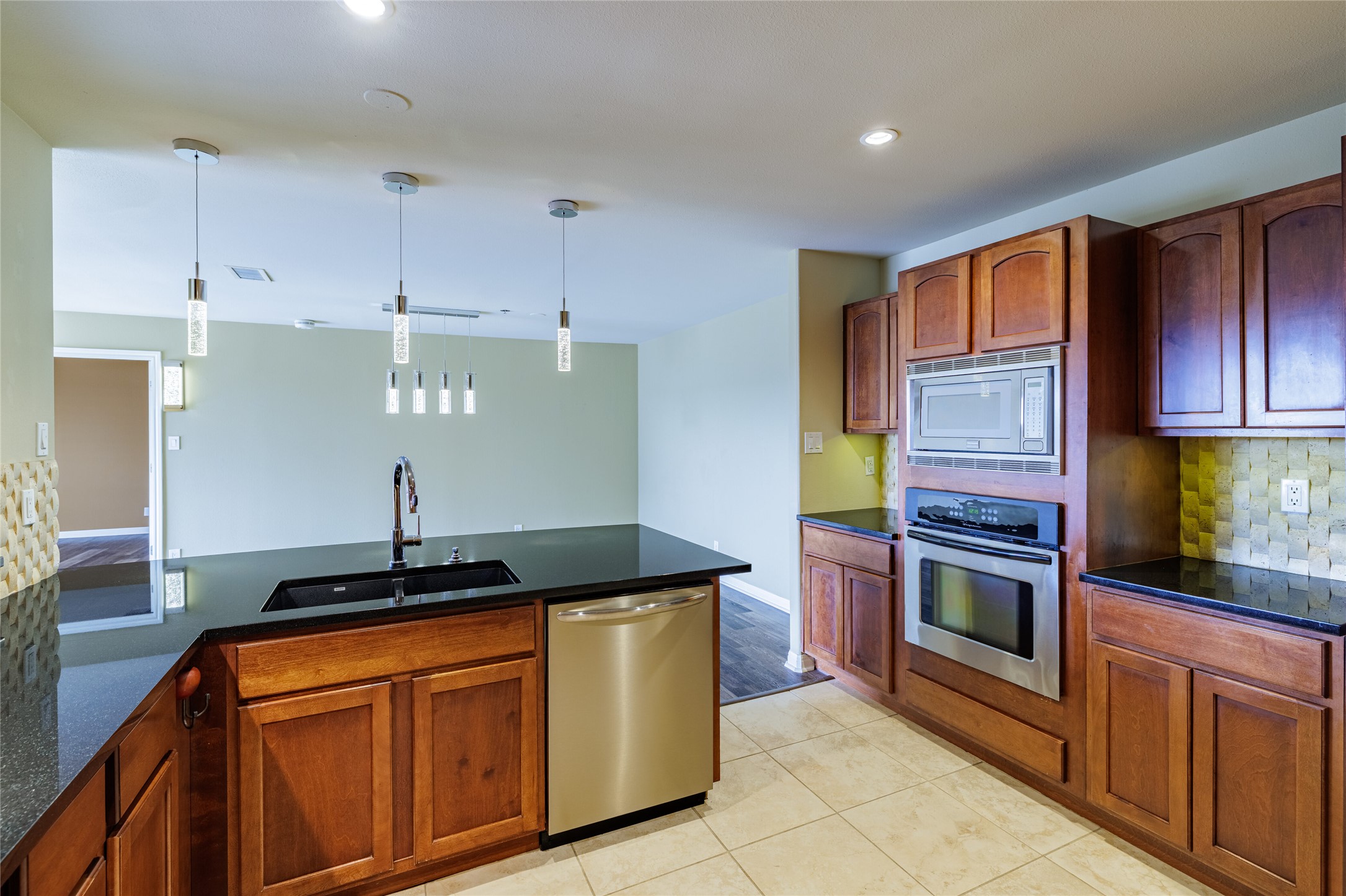 40 North Interstate Highway 35, Unit 6D3 Austin, TX 78701 - Photo 15 of 35 a kitchen with stainless steel appliances granite countertop a stove a sink and a refrigerator