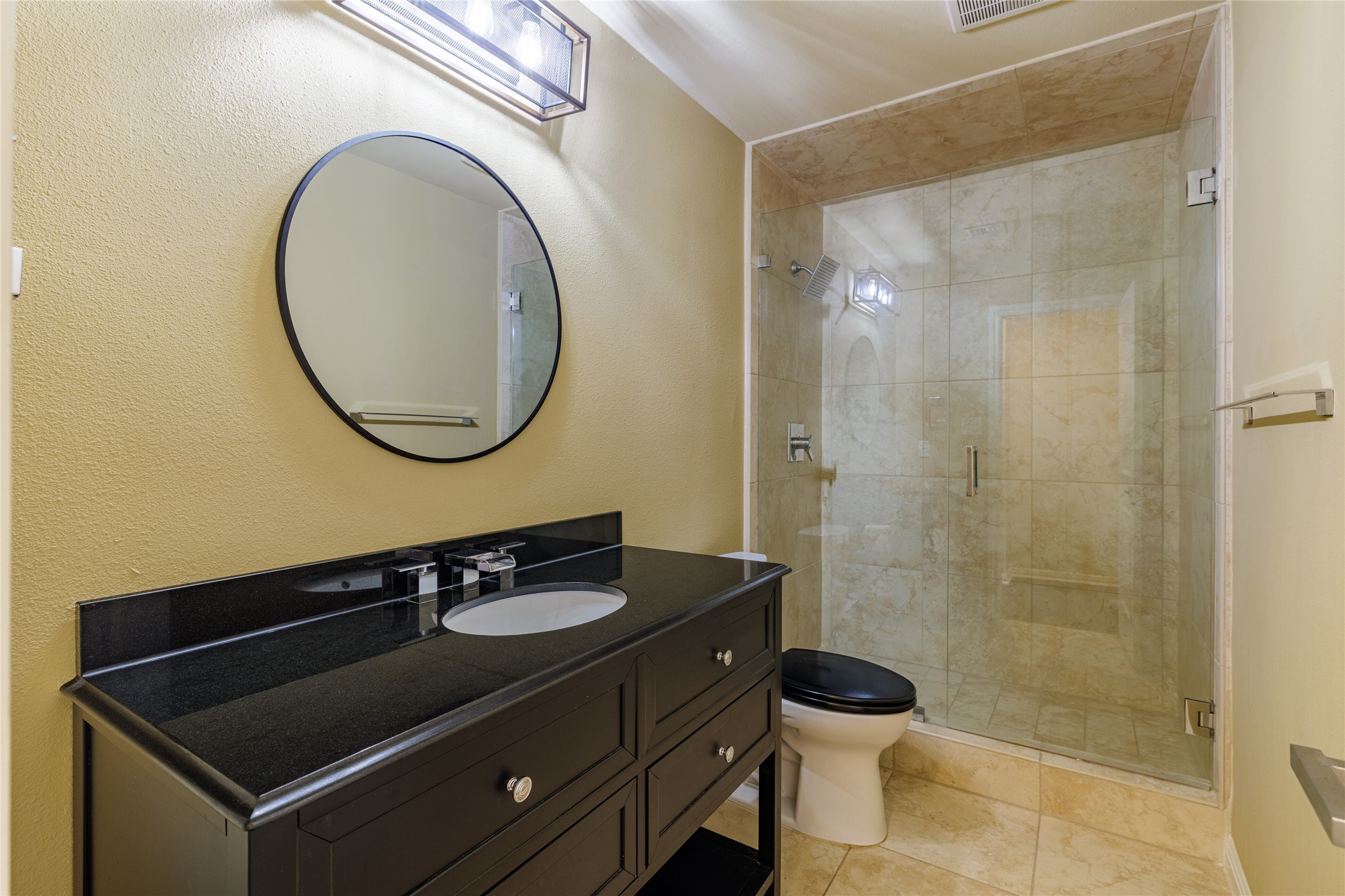 40 North Interstate Highway 35, Unit 6D3 Austin, TX 78701 - Photo 30 of 35 a bathroom with a sink a toilet and a mirror