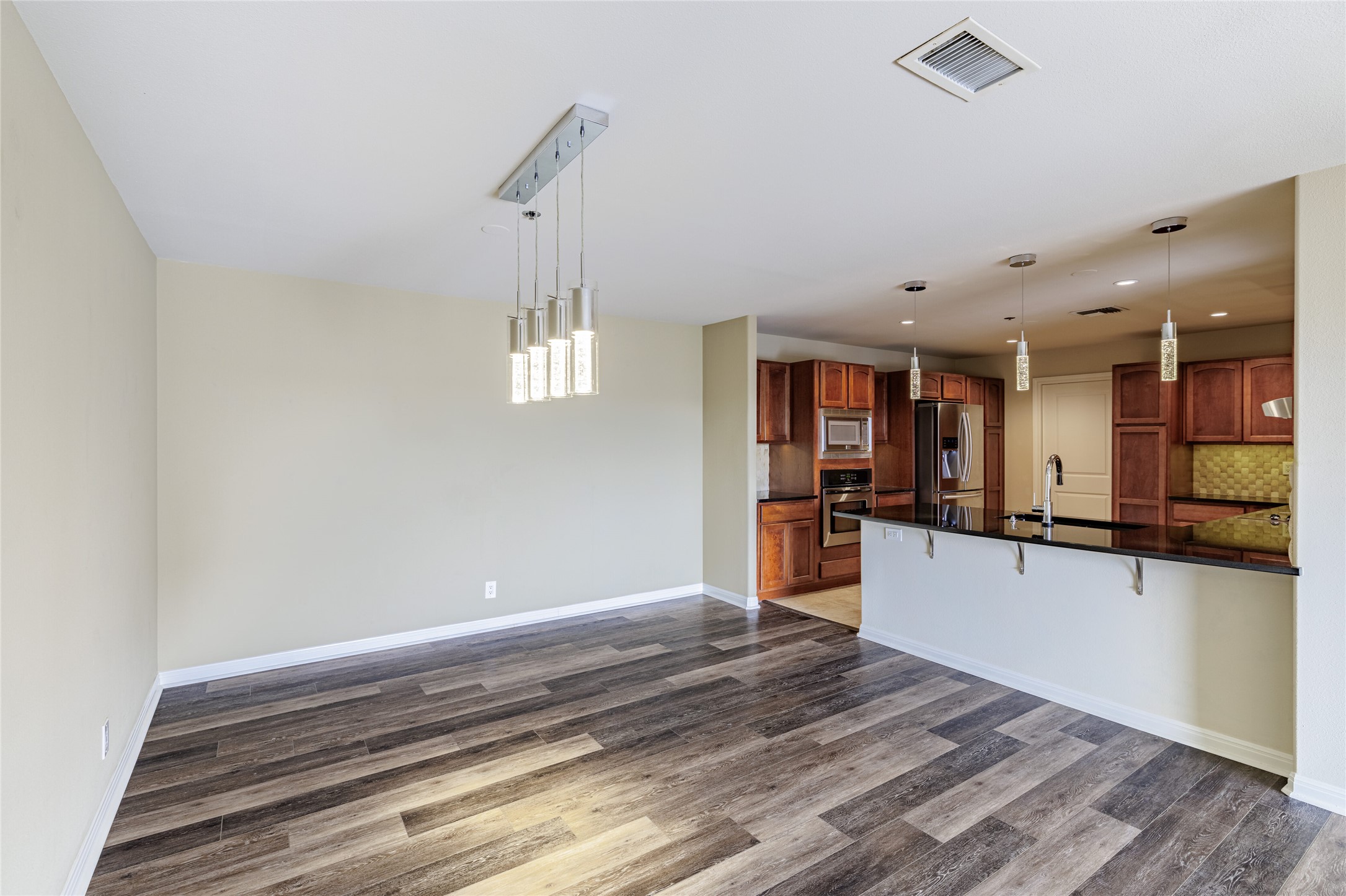 40 North Interstate Highway 35, Unit 6D3 Austin, TX 78701 - Photo 9 of 35 a large kitchen with kitchen island a counter space a sink and appliances