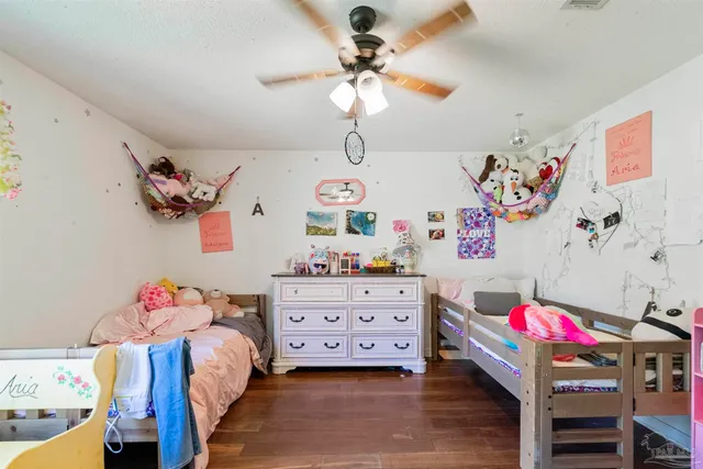 a bedroom with bed and furniture