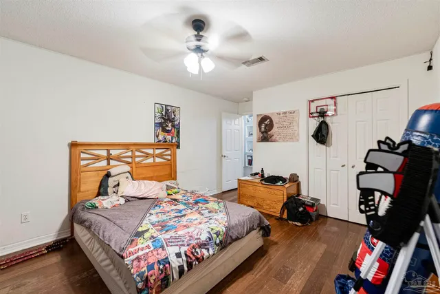a bed room with furniture and a window