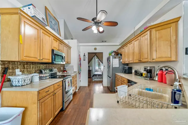 a utility room with sink dryer and washer
