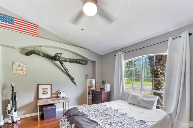 a spacious bathroom with a double vanity sink a mirror and a shower