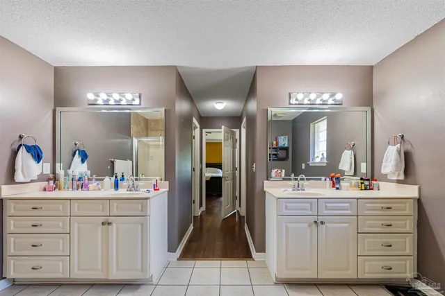 a bathroom with a bathtub sink and mirror