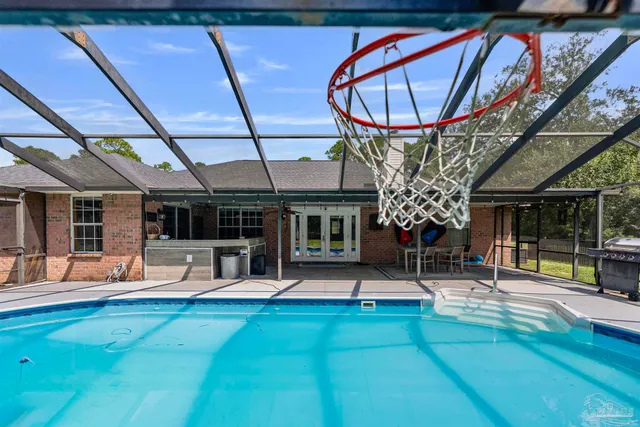 a view of a swimming pool with an outdoor seating