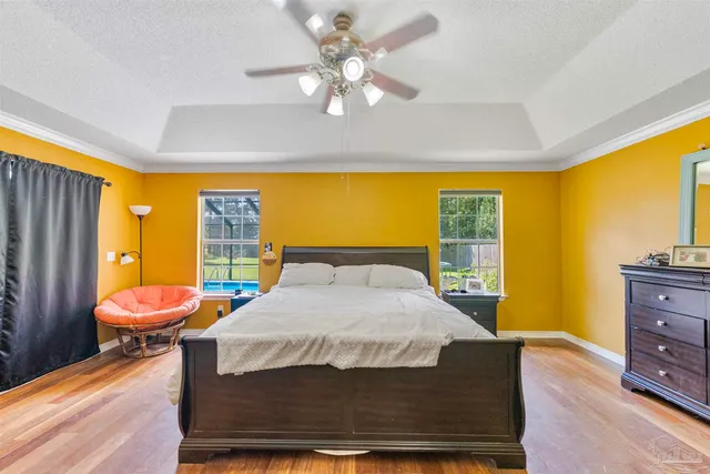 a living room with large window and a table