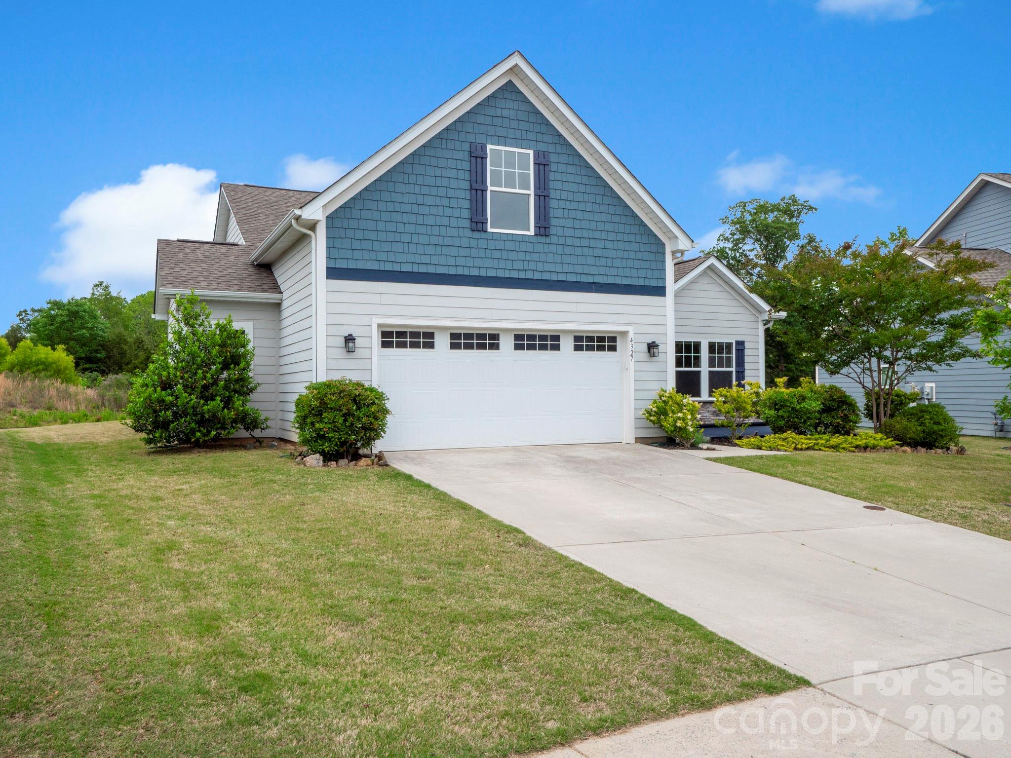 4327 Bent Green Lane Monroe, NC 28112 - Photo 1 of 28 a front view of a house with a yard and garage