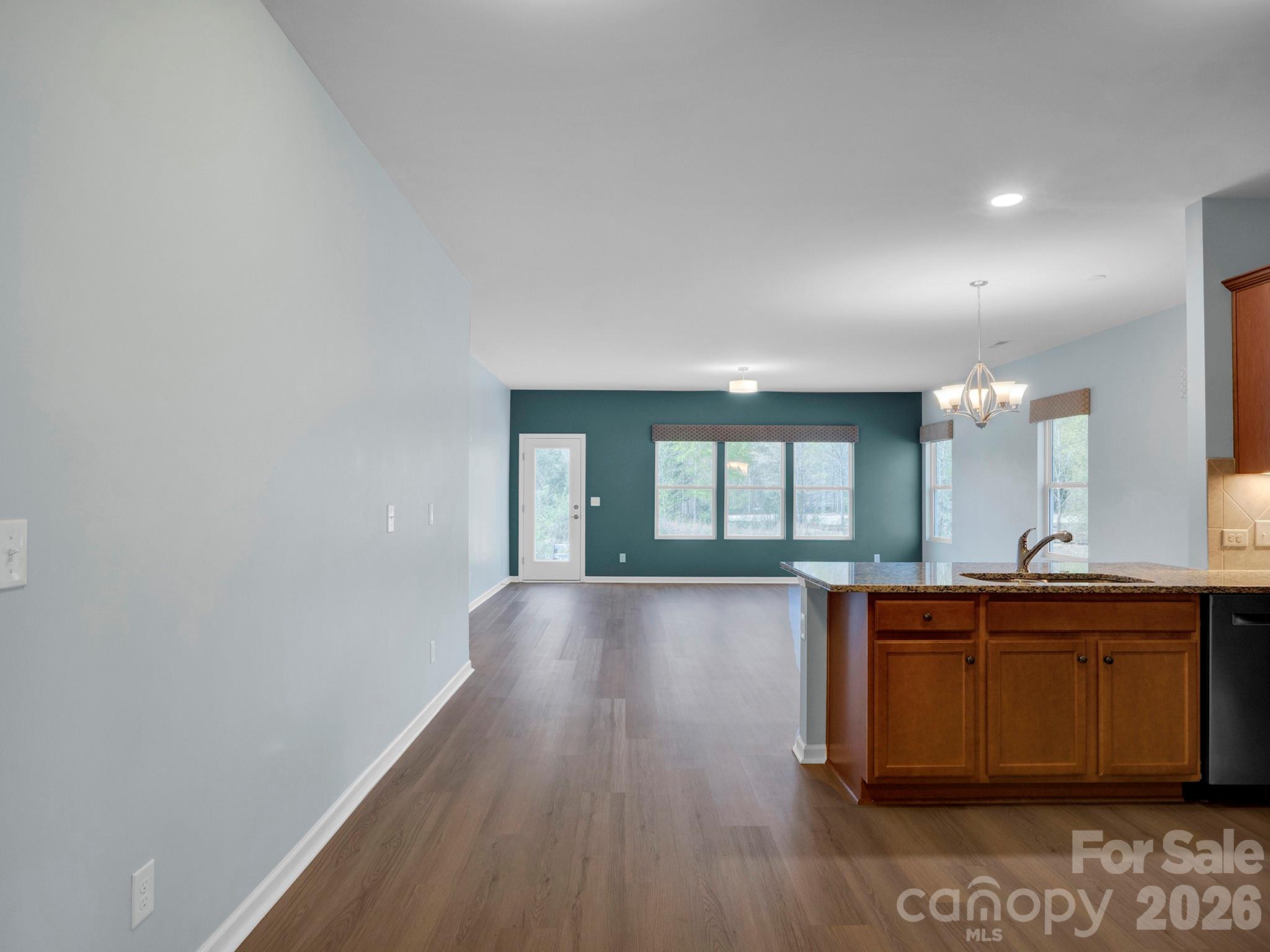 4327 Bent Green Lane Monroe, NC 28112 - Photo 11 of 28 a view of a kitchen counter space and wooden floor