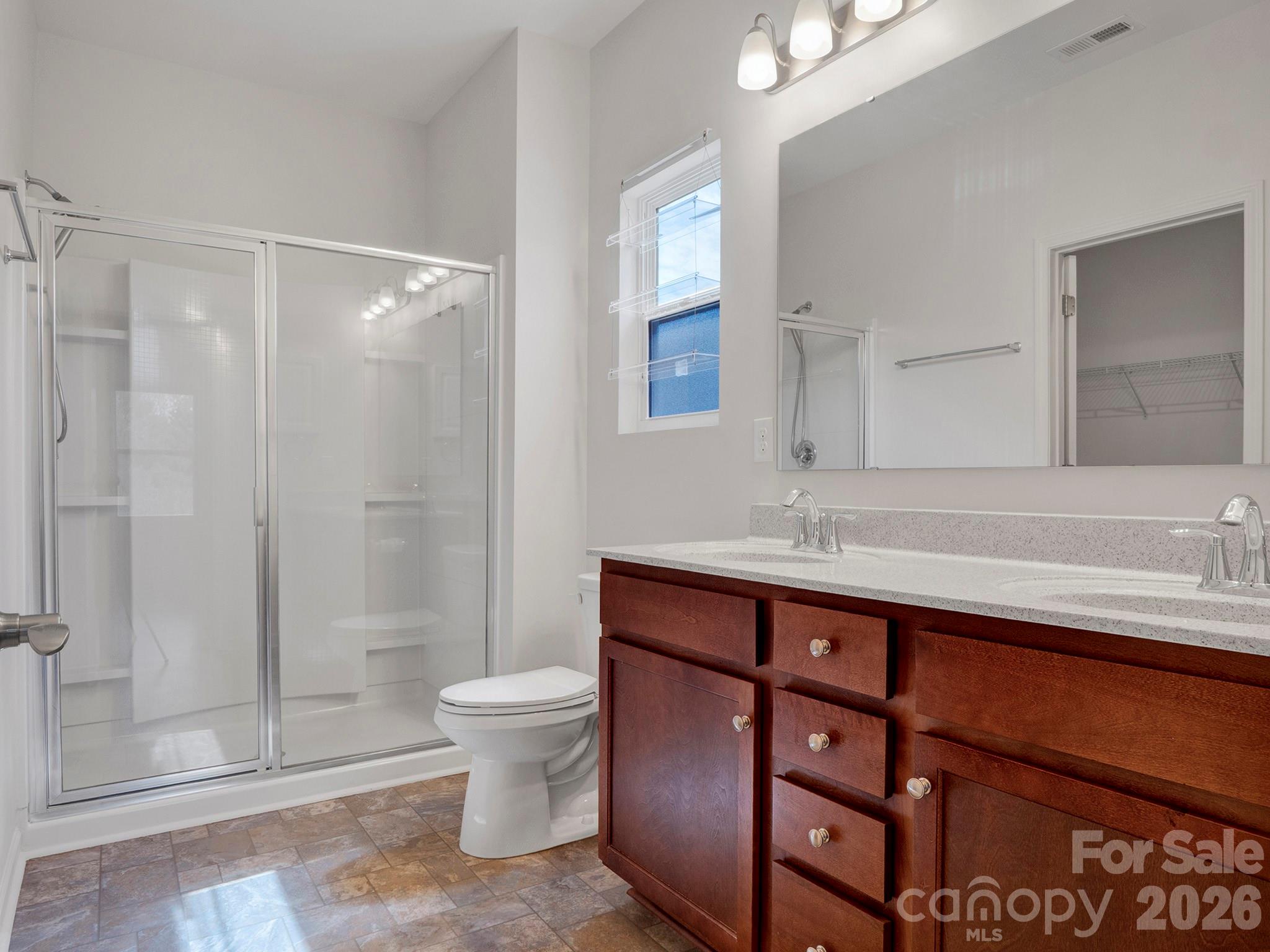 4327 Bent Green Lane Monroe, NC 28112 - Photo 18 of 28 a bathroom with a sink a toilet and shower