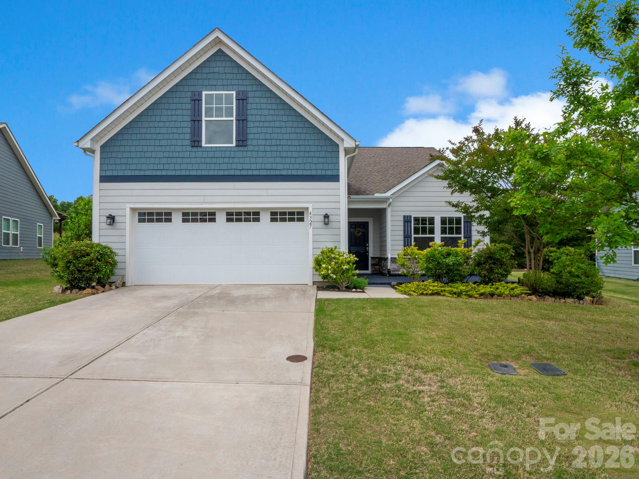 4327 Bent Green Lane Monroe, NC 28112 - Photo 2 of 28 a view of a house with backyard and garden