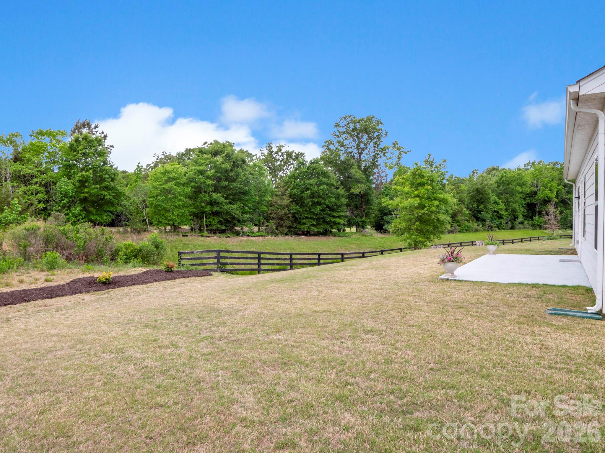 4327 Bent Green Lane Monroe, NC 28112 - Photo 3 of 28 a view of a dry yard with large trees