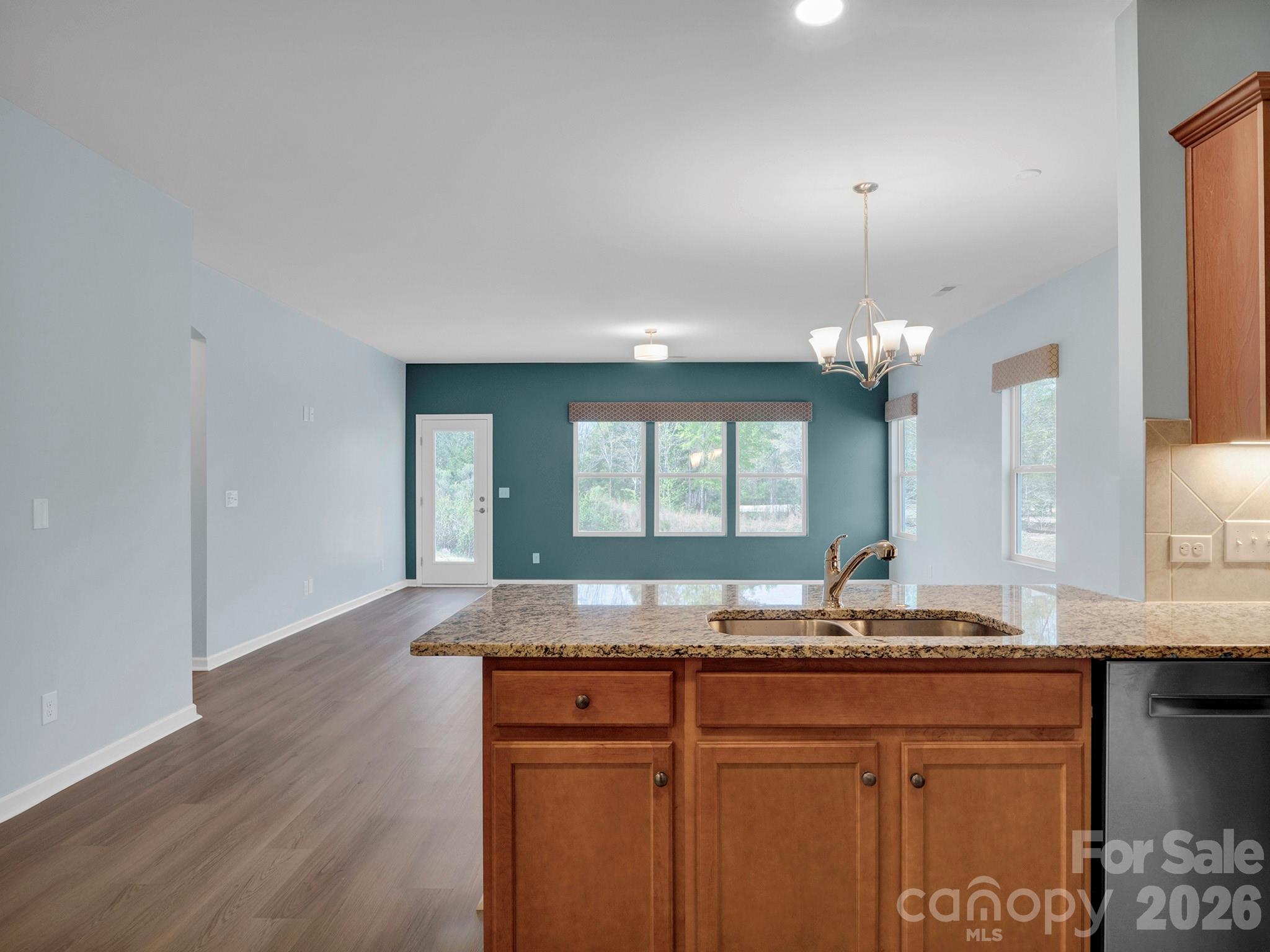 4327 Bent Green Lane Monroe, NC 28112 - Photo 10 of 28 a bathroom with a granite countertop sink and a large mirror