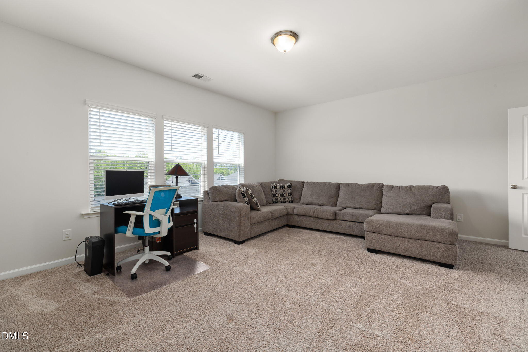 3422 Longleaf Estates Drive Raleigh, NC 27616 - Photo 30 of 71 a living room with furniture and a flat screen tv