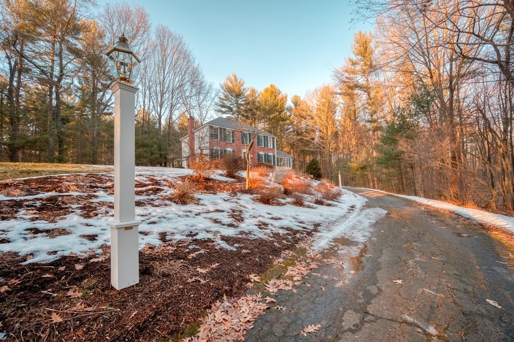 873 Depot Road Boxborough, MA 01719 - Photo 33 of 33 a backyard of a house with lots of green space