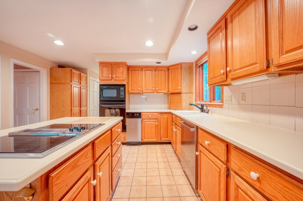 873 Depot Road Boxborough, MA 01719 - Photo 6 of 33 a kitchen with stainless steel appliances granite countertop a sink and cabinets