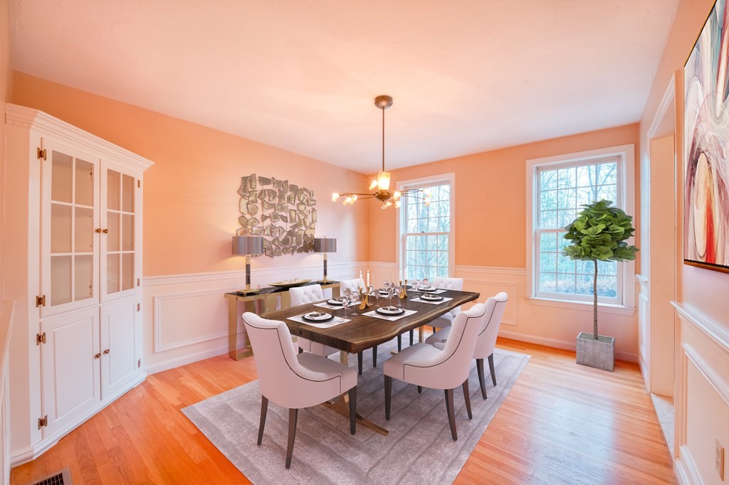 873 Depot Road Boxborough, MA 01719 - Photo 10 of 33 a dining room with furniture a chandelier and wooden floor