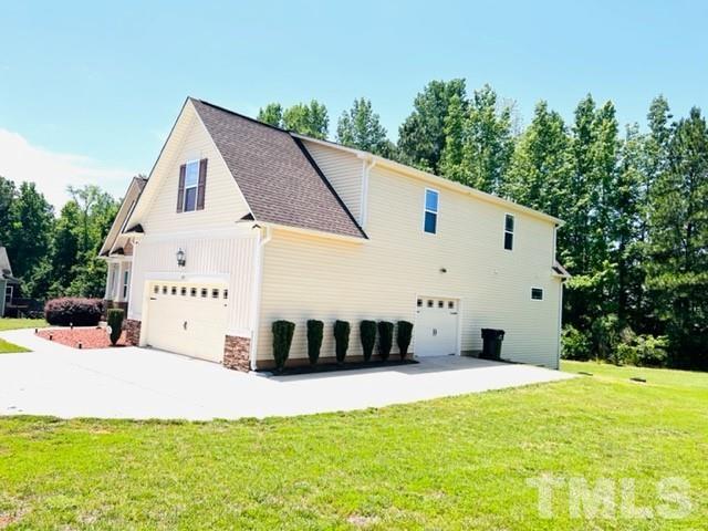 70 Breadnut Drive Smithfield, NC 27577 - Photo 4 of 19 a view of a white house with a yard