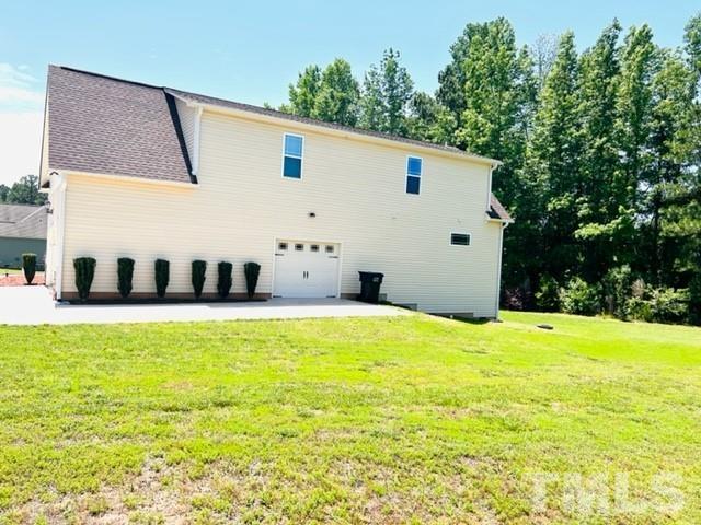 70 Breadnut Drive Smithfield, NC 27577 - Photo 5 of 19 a view of a swimming pool with an outdoor space and seating area