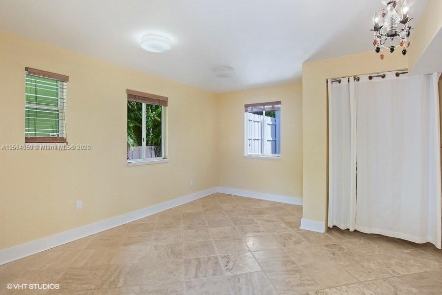 335 Pacific Road Key Biscayne, FL 33149 - Photo 15 of 50 a view of an empty room with a window